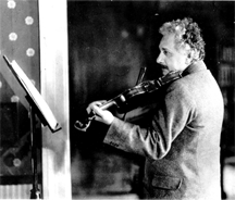 Albert Einstein playing his violin on his 50th birthday in 1929