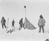 Robert F. Scott and three of his party arrive at a tent left by Roald Amundsen near the South Pole