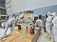 Contamination control engineers conduct the receiving inspection of a space telescope