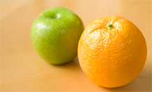 An apple and an orange. The phrase "comparing apples and oranges" is idiomatic for "false equivalence fallacy"