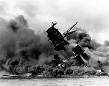 The battleship <cite>USS Arizona</cite>, burning during the Japanese attack on the U.S. naval base at Pearl Harbor, Hawaii, December 7, 1941