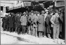 Bowery men waiting for bread in a bread line in New York City in 1910