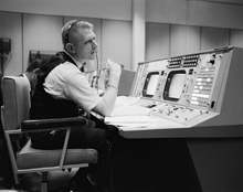 Eugene F. Kranz, flight director, at his console on May 30, 1965, in the Control Room in the Mission Control Center at Houston