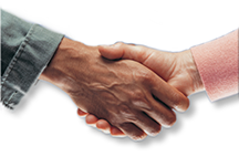 A man and a woman shaking hands in cautious
agreement