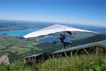 A hang glider pilot taking off