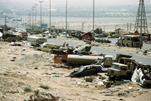 Demolished vehicles line Highway 80, also known as the "Highway of Death"