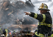 New York Fire Department Deputy Chief Joseph Curry calls for rescue teams at Ground Zero three days after the 9/11 terrorist attacks