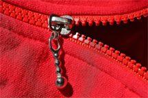 A red molded plastic zipper