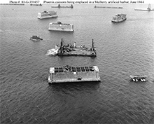 Phoenix caissons being towed to form a Mulberry harbor off Normandy, June 1944