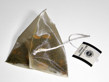 A pyramidal silk teabag of spiced black tea