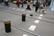 Traffic bollards in Sofia, Bulgaria, let trams pass by then deploy again