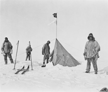 Robert F. Scott and three of his party arrive at a tent left by Roald Amundsen near the South Pole