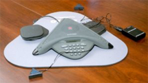 A speakerphone of a type in common use for teleconferences
