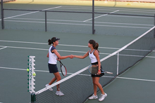 Tennis players shake hands after their match