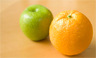 An apple and an orange. The phrase "comparing apples and oranges" is idiomatic for "false equivalence fallacy"