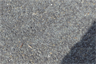 A close-up view of a chipseal road surface