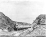 An excavator loads spoil into rail cars in the Culebra Cut, Panama, 1904