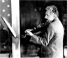 Albert Einstein playing his violin on his 50th birthday in 1929