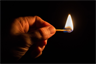 Holding a lighted match