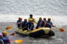 A white water rafting team completes its course