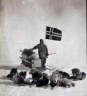 Oscar Wisting, a member of Roald Amundsen's party, and his dog team at the South Pole in 1911