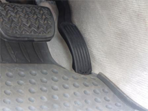 Example of an unsecured driver-side floor mat trapping the accelerator pedal in a 2007 Toyota Lexus ES350